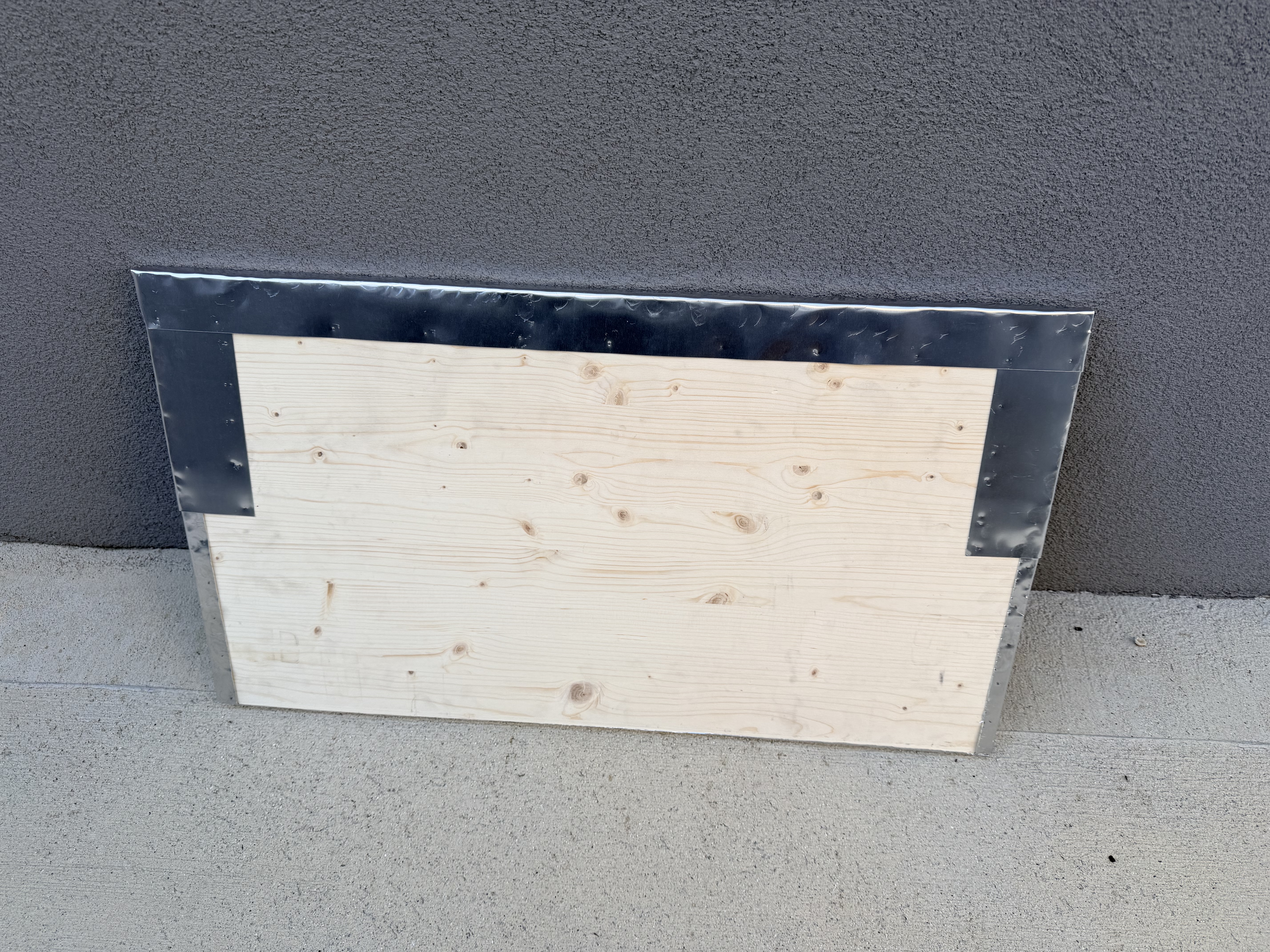 Underside of the roof panel showing the aluminium folds pinned into the edges